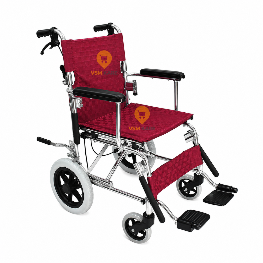 A lightweight folding wheelchair with a metallic silver frame, black armrests and wheels, and red textured fabric seat and backrest cushions. The cushions feature a yellow VSM logo.